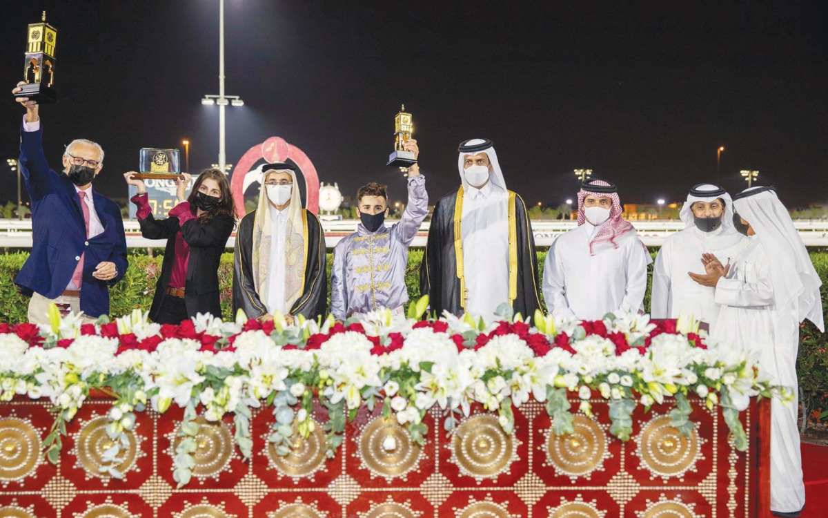 Minister of Culture and Sports, H E Salah bin Ghanem Al Ali, and Chairman of the Qatar and Asian Equestrian Federations, Hamad bin Abdulrahman Al Attiyah, posing for a photograph with Team Al Namaa after Al Shaqab Racing's homebred horse won the Late Shei