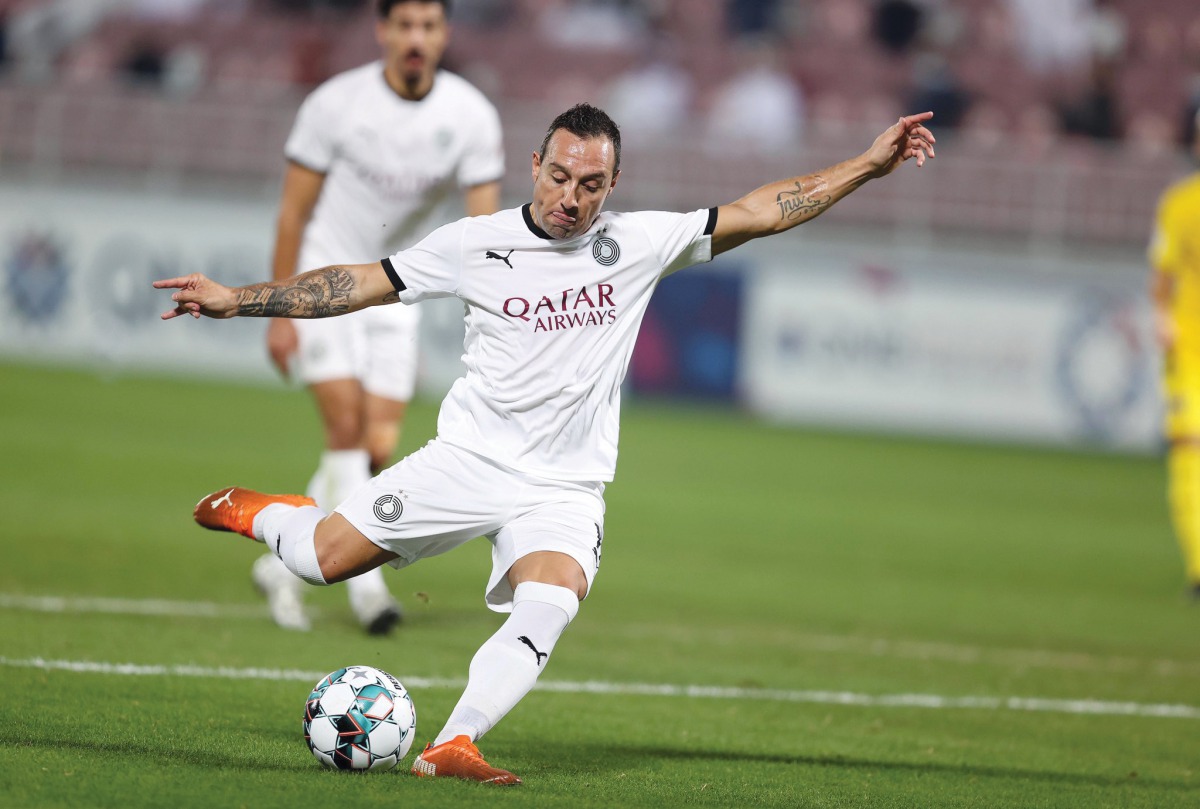 Al Sadd's Santi Cazorla shoots to score against Al Gharafa.