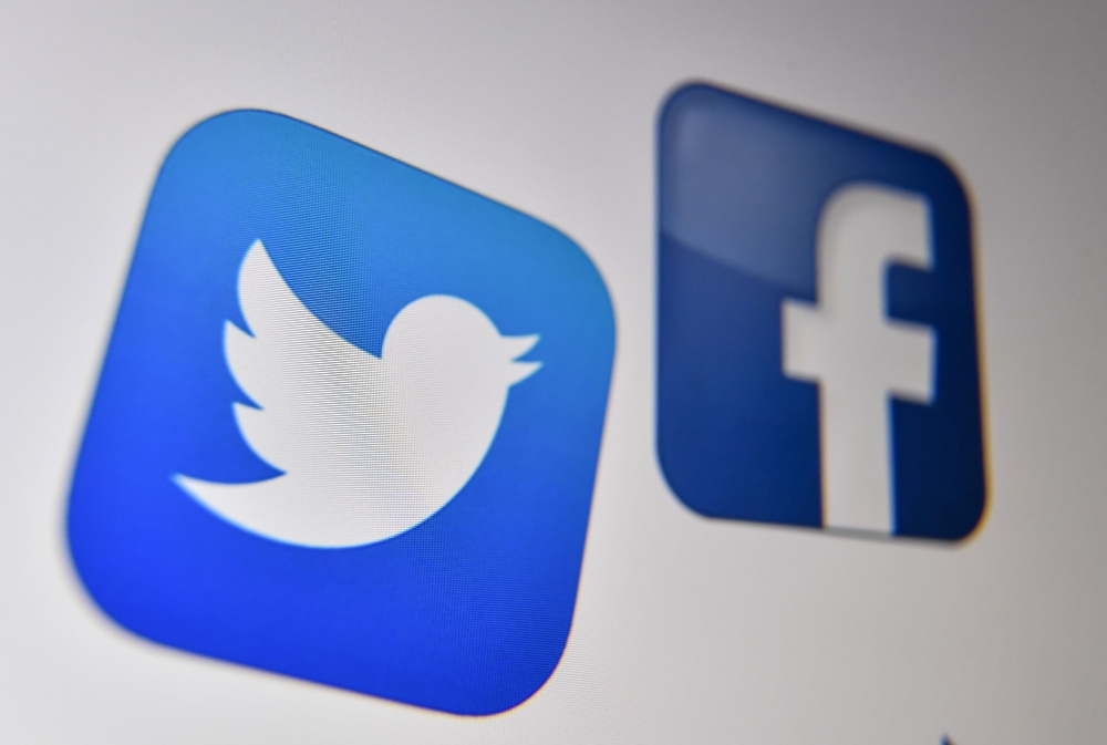 The logo of the American online social media and social networking service, Facebook and Twitter on a computer screen in Lille.   AFP / Denis Charlet