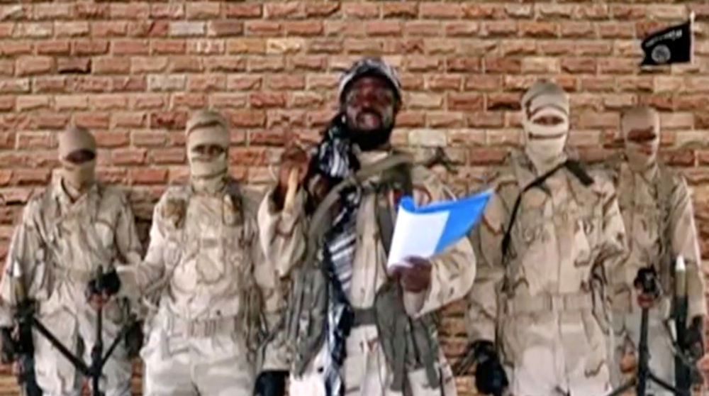 FILE PHOTO: The leader of one of the Boko Haram group's factions, Abubakar Shekau speaks in front of guards in an unknown location in Nigeria in this still image taken from an undated video obtained on January 15, 2018. 