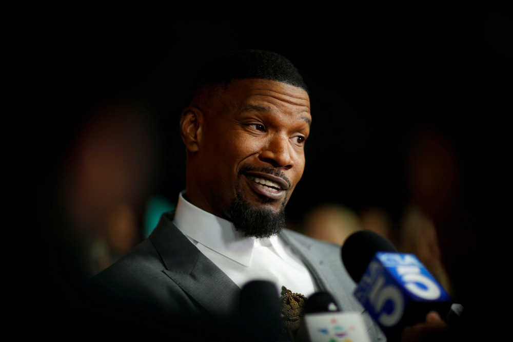 Cast member Jamie Foxx is interviewed at a community screening for the film 