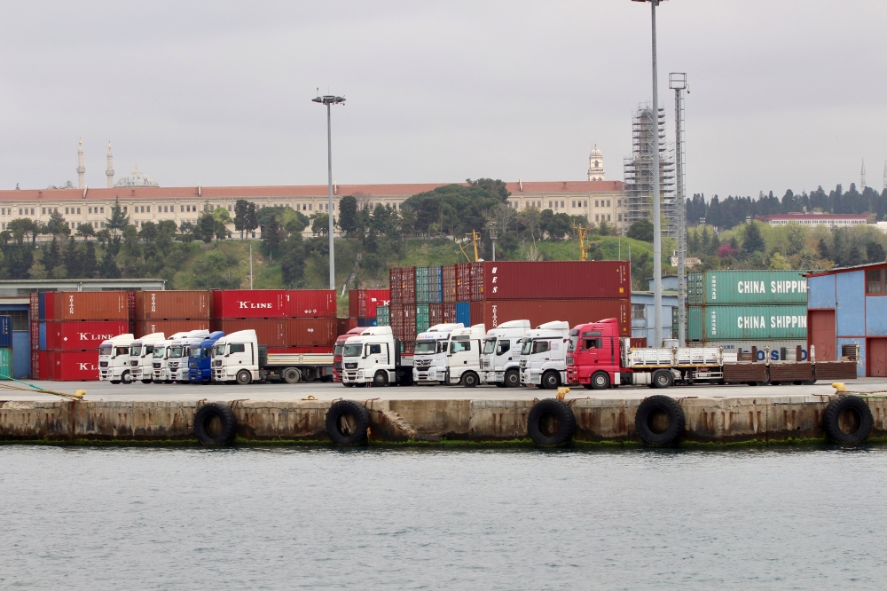 FILE PHOTO: Trucks and shipping containers are pictured at Haydarpasa port in Istanbul, Turkey, April 18, 2018. REUTERS/Yoruk Isik