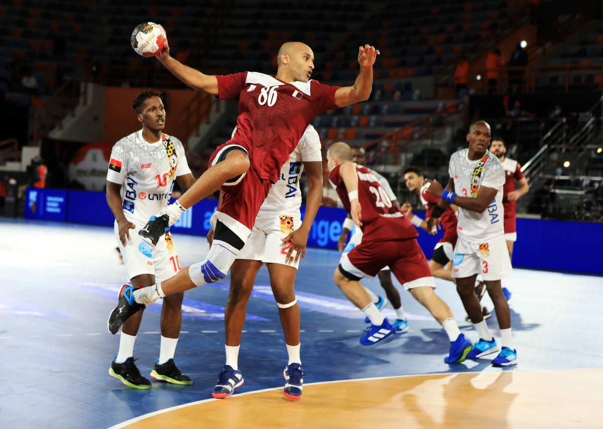 Qatar’s Mahmoud Hassaballa prepares to shoot at the goal during the 2021 IHF Handball World Championship   Preliminary Round Group C match against Angola yesterday.