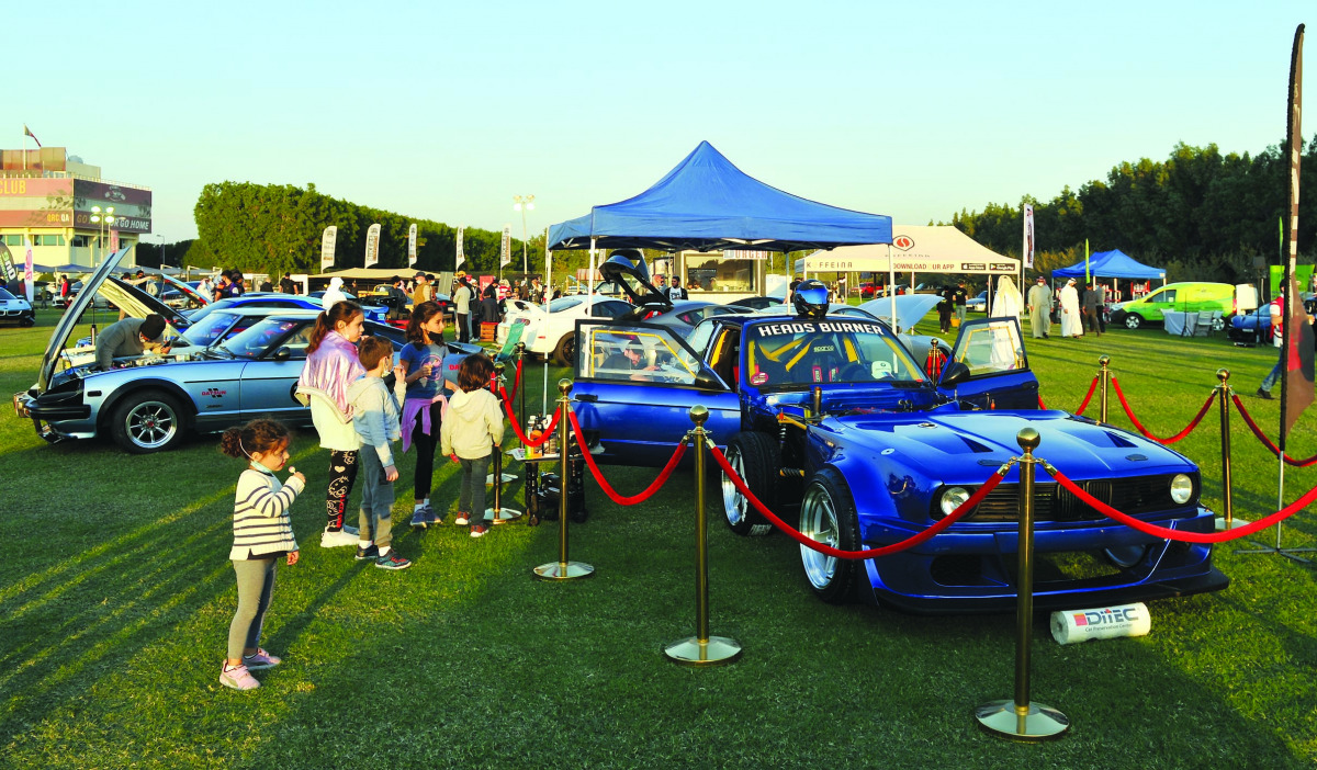 Children take a look at a customised car on display at the Qatar Custom Show. Pic: Salim Matramkot/The Peninsula
