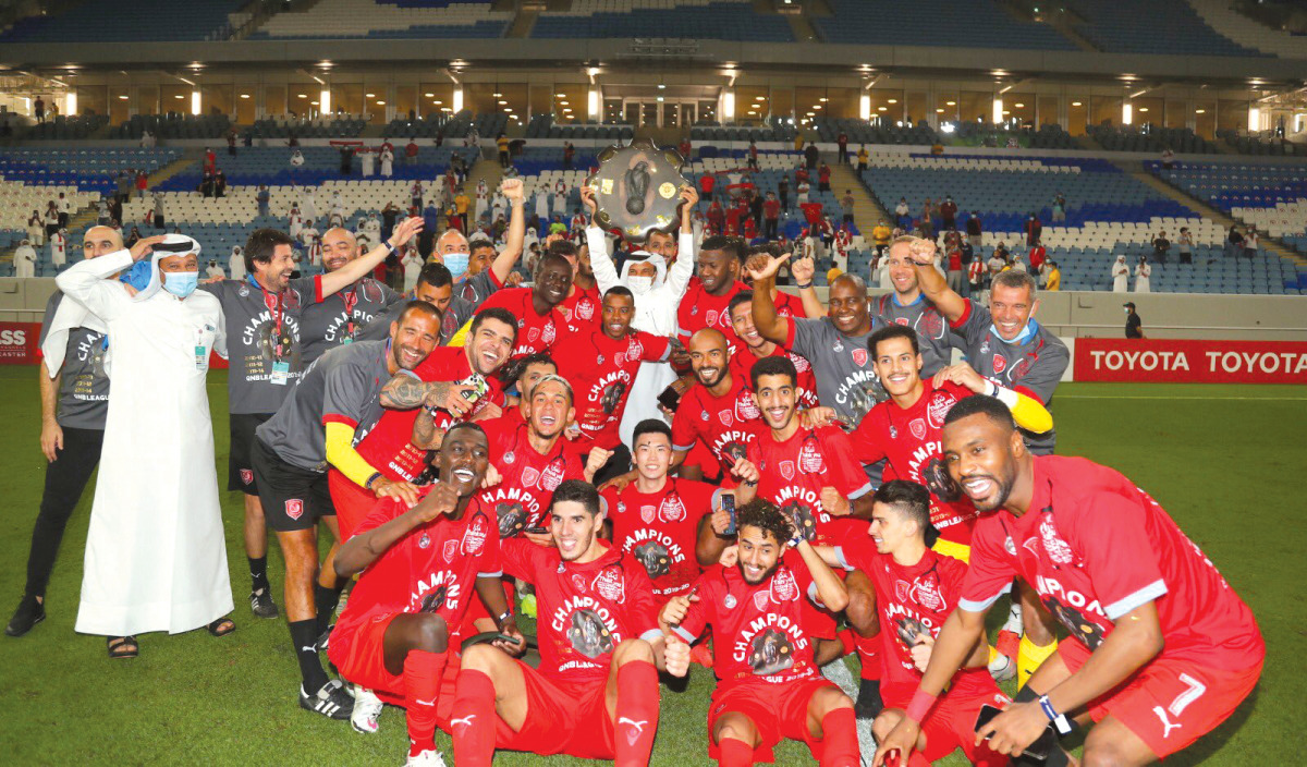 Al Duhail's players and officials celebrate with the Falcon Shield in this file photo. 