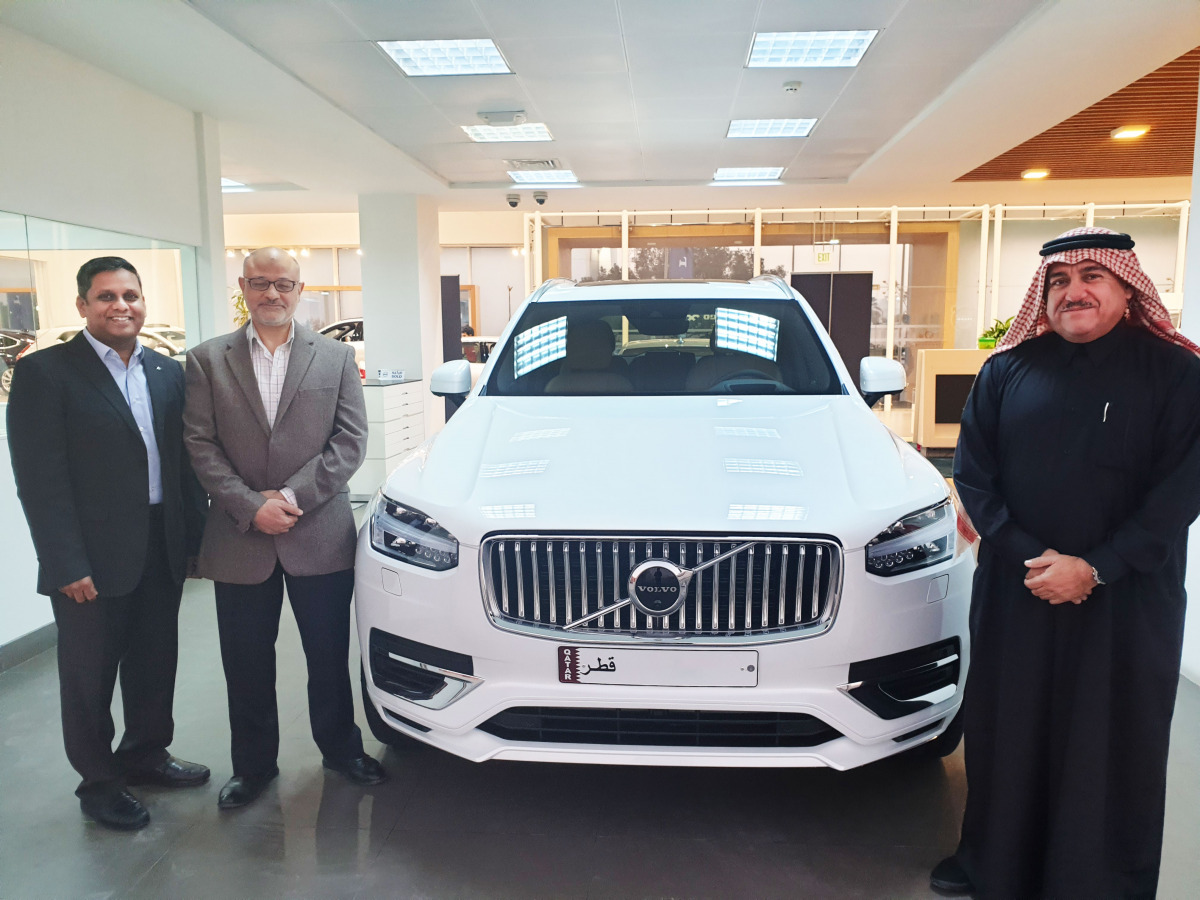 Officials from Volvo beside the first Volvo XC90 Recharge, a plug-in Hybrid electric vehicle.