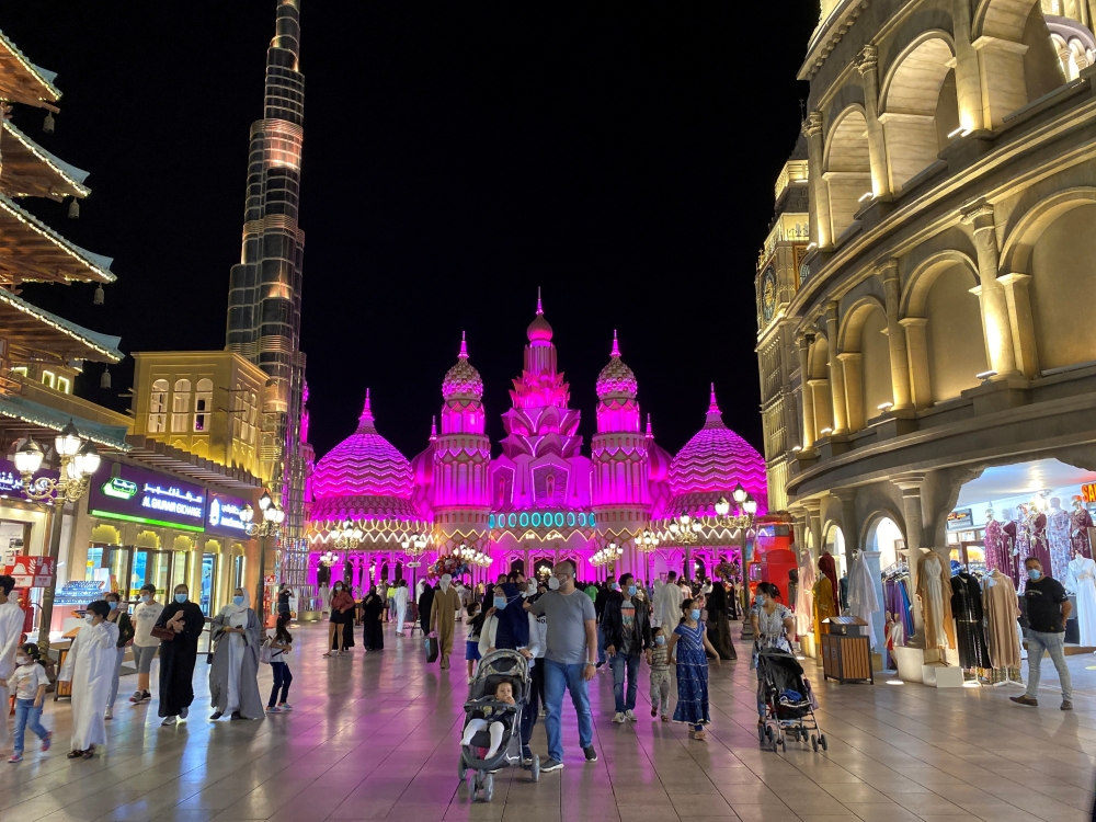 FILE PHOTO: People wear face masks amid the spread of coronavirus disease (COVID-19) at the Global Village in Dubai, United Arab Emirates November 17, 2020. REUTERS/Ahmed Jadallah