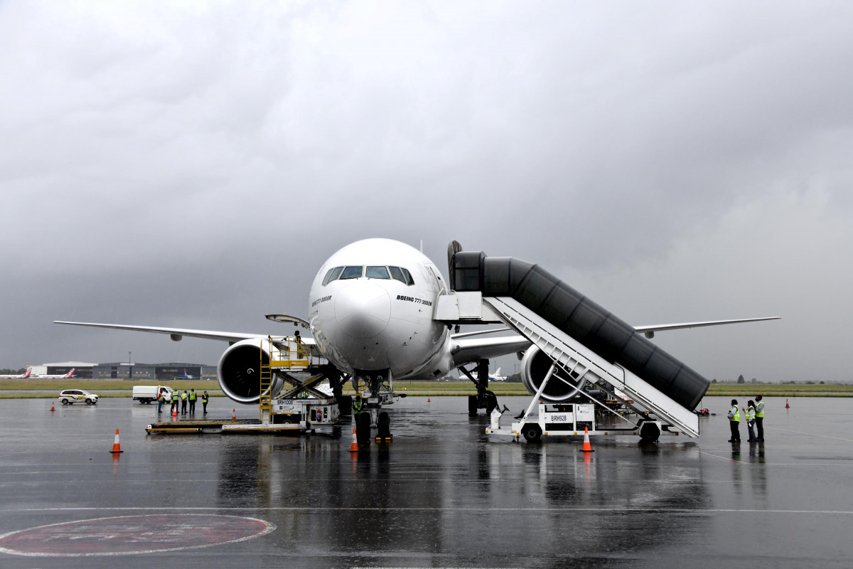 An aircraft carrying South Africa's first coronavirus disease (COVID-19) vaccine doses arrives at OR Tambo airport in Johannesburg, South Africa, in this handout picture taken February 1, 2021. Elmond Jiyane for GCIS/Handout via REUTERS