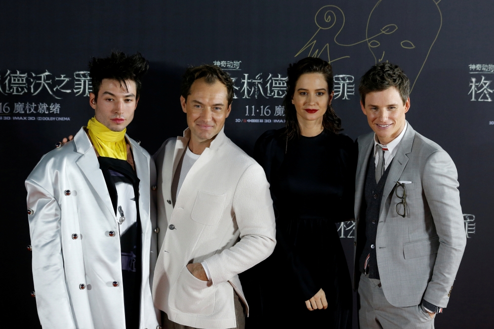 Cast members Ezra Miller, Jude Law, Katherine Waterston and Eddie Redmayne attend a promotion for the movie 