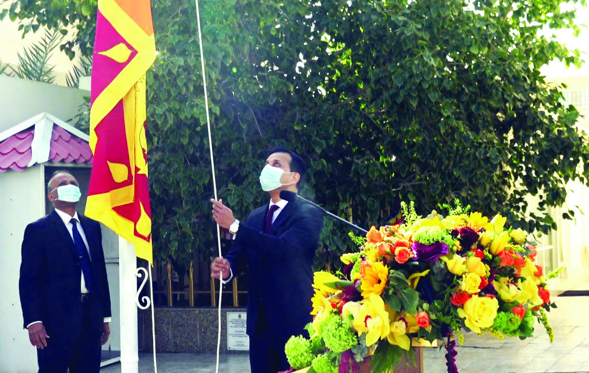 Sri Lanka's Ambassador-designate M. Mafaz Mohideen hoisting the national flag.  