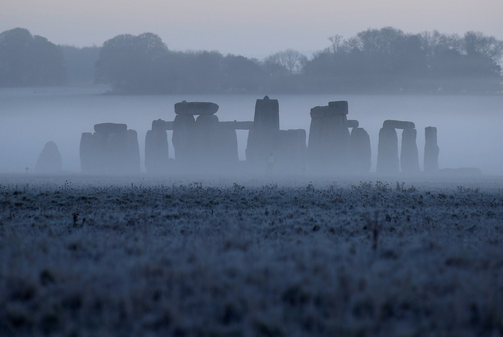 Stonehenge ancient stone circle is seen at dawn, near Amesbury, Wiltshire, Britain, November 4, 2020. REUTERS/Toby Melville/File Photo