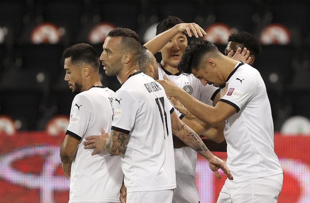 Al Sadd's players celebrate after Baghdad Bounedjah (right) scored team's opening goal yesterday. 