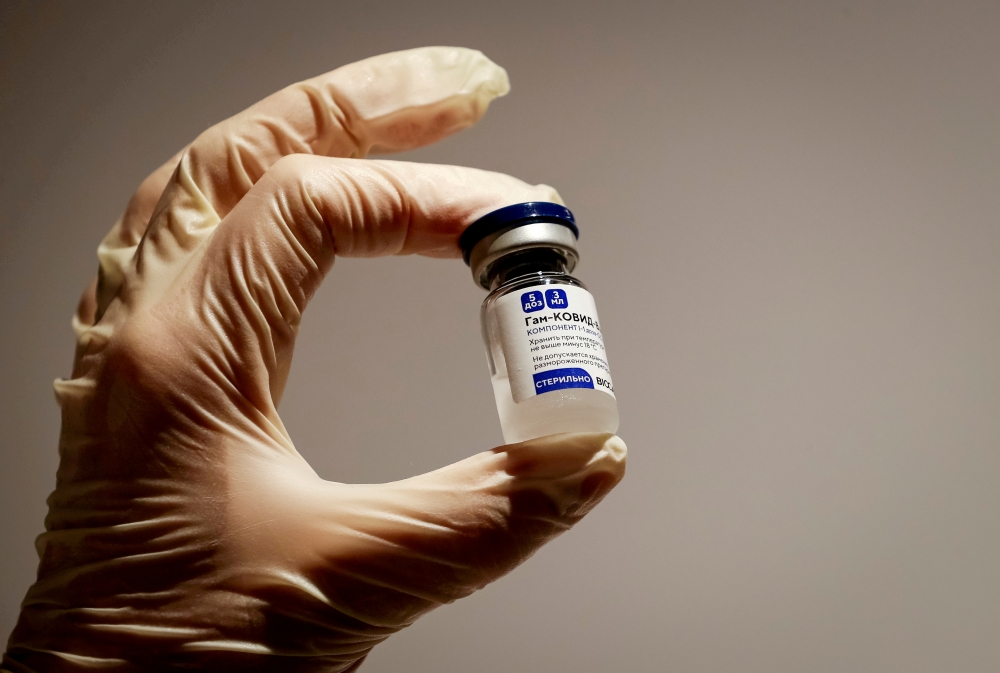 A medical specialist holds a vial of Sputnik V vaccine against the coronavirus in a department store in Moscow, Russia, January 18, 2021. REUTERS/Shamil Zhumatov/File Photo