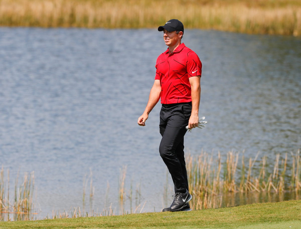 Feb 28, 2021; Bradenton, Florida, USA; Rory McIlroy walks to the second green wearing red and black honoring Tiger Woods during the final round of World Golf Championships at The Concession golf tournament at The Concession Golf Club. Mandatory Credit: Mi