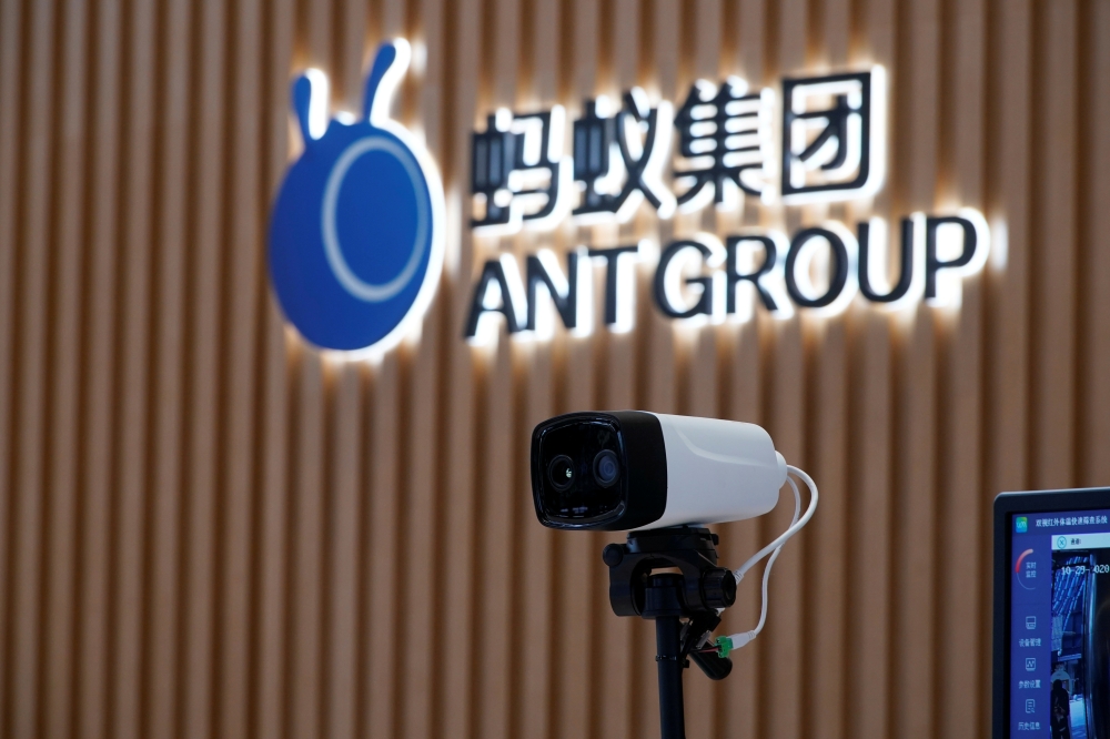FILE PHOTO: A thermal imaging camera is seen in front of a logo of Ant Group at the headquarters of Ant Group, an affiliate of Alibaba, in Hangzhou, Zhejiang province, China October 29, 2020. REUTERS/Aly Song/File Photo