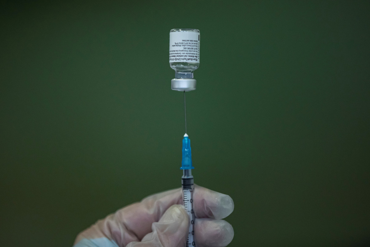 A medical worker fills a syringe with Pfizer-BioNTech vaccine at the COVID-19 vaccination centre of 'Healthcare Centre' in Nis, Serbia, March 3, 2021. REUTERS/Marko Djurica

