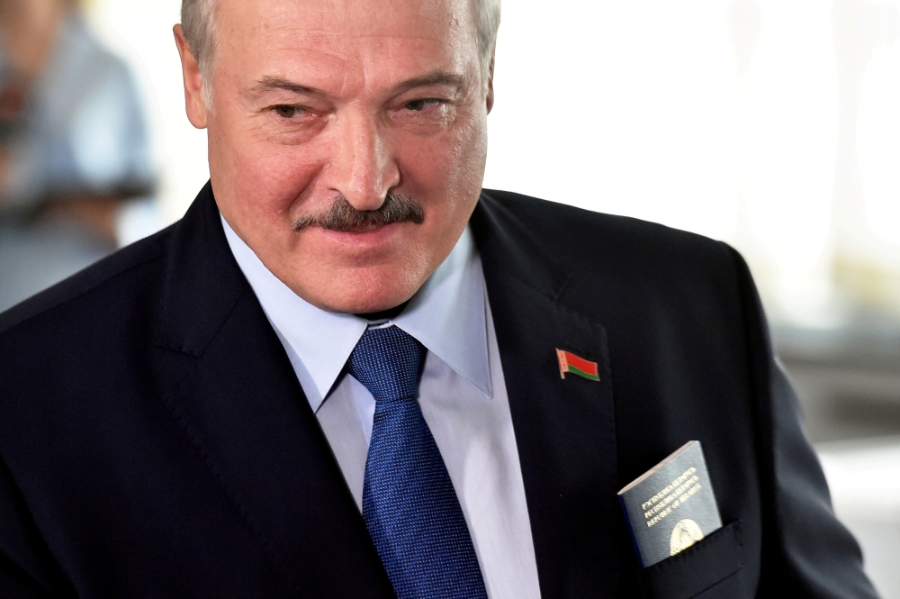 File photo: Belarusian President Alexander Lukashenko visits a polling station during the presidential election in Minsk, Belarus August 9, 2020. Sergei Gapon/Pool via REUTERS/File Photo