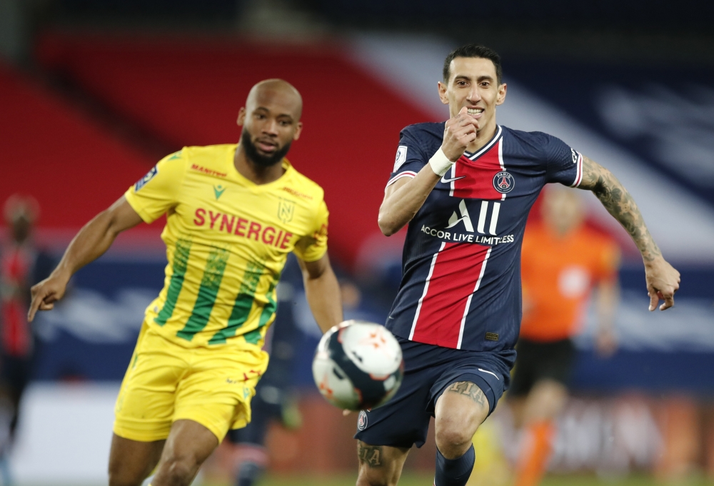 Paris St Germain's Angel Di Maria in action with Nantes' Marcus Coco REUTERS/Benoit Tessier