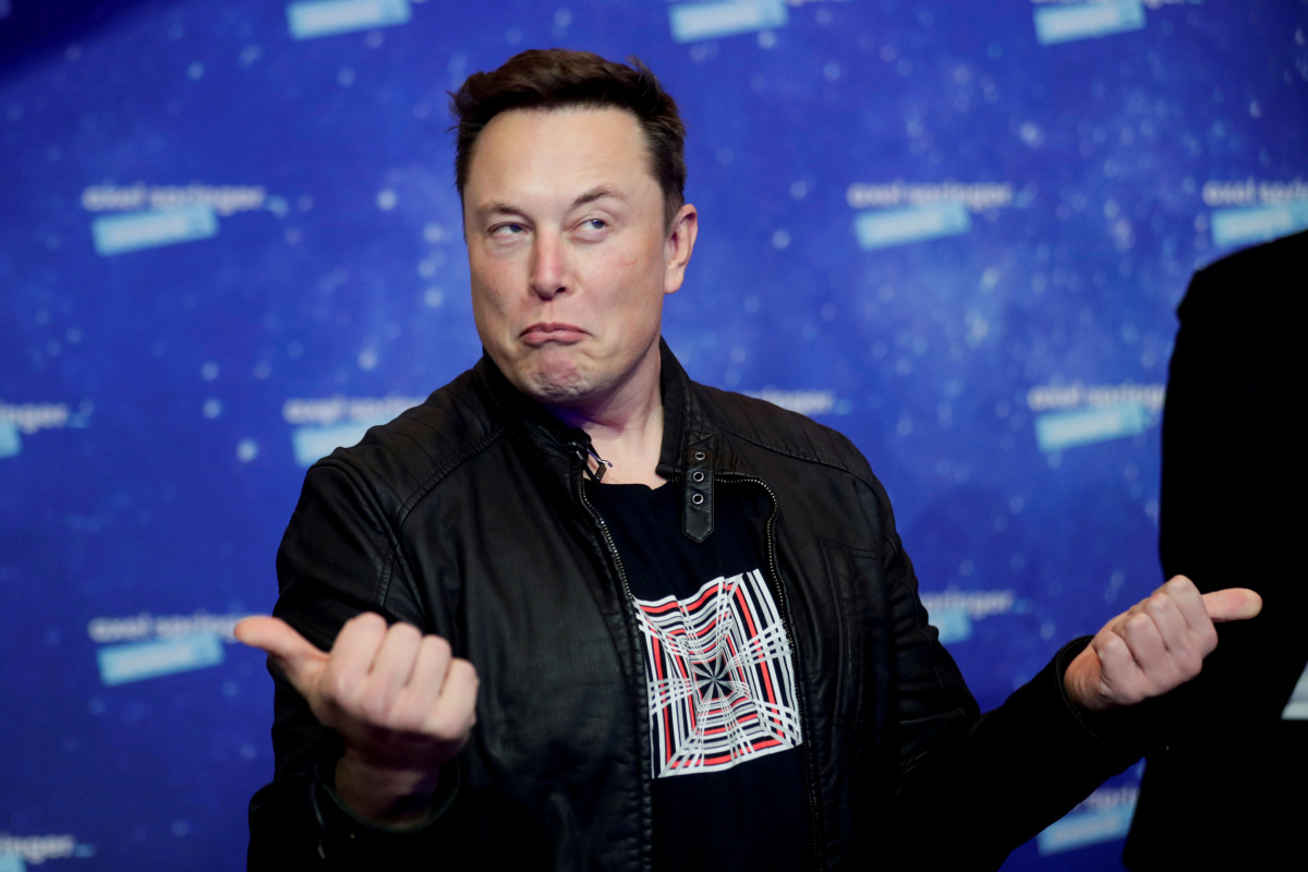 FILE PHOTO: SpaceX owner and Tesla CEO Elon Musk grimaces after arriving on the red carpet for the Axel Springer award, in Berlin, Germany, December 1, 2020. REUTERS/Hannibal Hanschke/Pool/File Photo/File Photo
