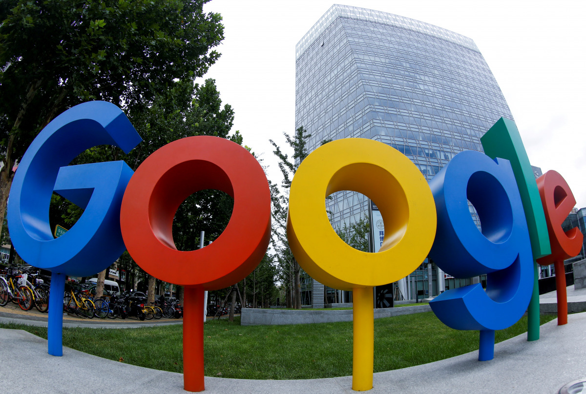 FILE PHOTO: The brand logo of Alphabet Inc's Google is seen outside its office in Beijing, China August 8, 2018. Picture taken with a fisheye lens. REUTERS/Thomas Peter/File Photo
