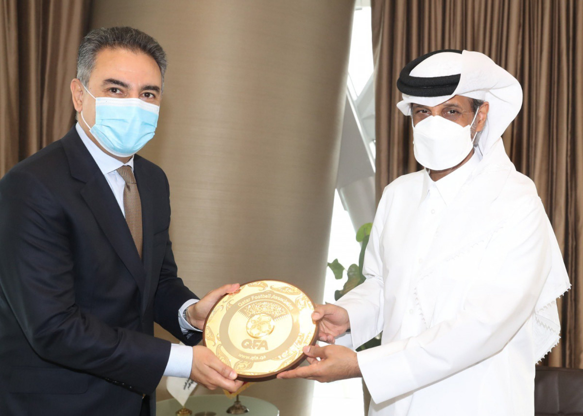 The President of Qatar Football Association, Sheikh Hamad bin Khalifa bin Ahmed Al Thani, presenting a memento to Ambassador of the Kingdom of Morocco to Qatar, H E Mohamed Setri.