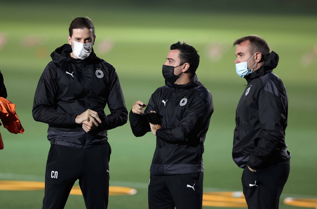 Al Sadd coach Xavi Hernandez (centre) during Al Sadd's training session.