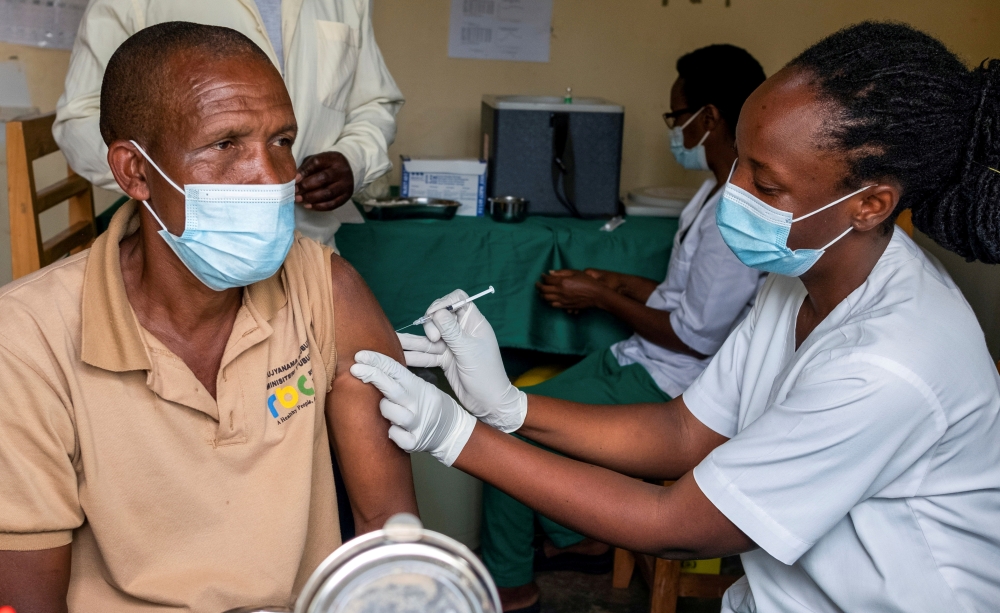  A man receives a vaccine against the coronavirus disease (COVID-19) at the Masaka hospital in Kigali, Rwanda March 5, 2021. REUTERS/Jean Bizimana/File Photo

