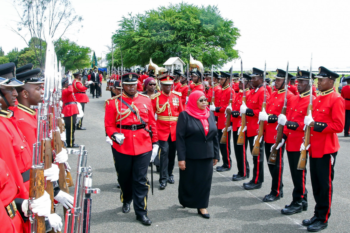 Tanzania's new President Samia Suluhu Hassan inspects a guard of honour mounted by the Tanzania Peoples Defense Forces after she was sworn into office following the death of her predecessor John Pombe Magufuli at State House in Dar es Salaam, Tanzania Mar