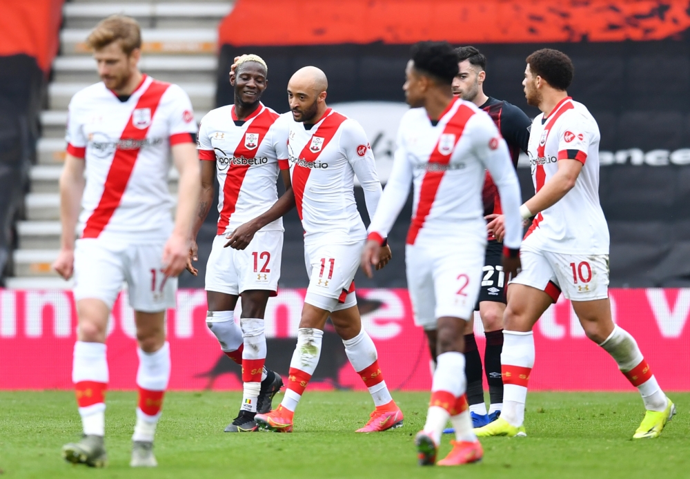 Southampton's Nathan Redmond celebrates scoring their second goal with Moussa Djenepo and teammates REUTERS/Dylan Martinez