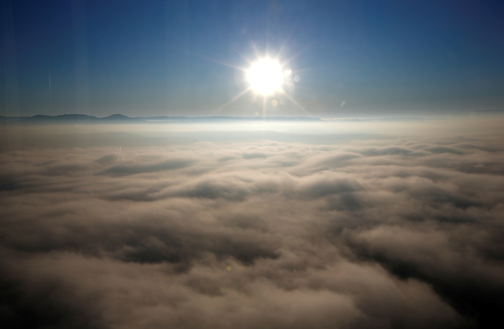 A sunrise is seen from Thyssenkrupp's test tower in Rottweil, Germany, January 21, 2020. REUTERS/Michaela Rehle/File Photo