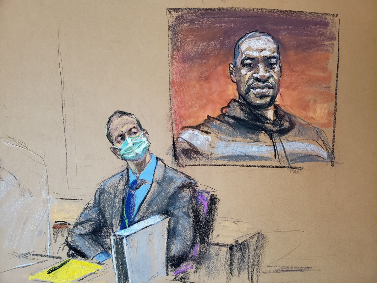 FILE PHOTO: Former Minneapolis police officer Derek Chauvin sits in front of a picture of George Floyd displayed during Chauvin's trial for second-degree murder, third-degree murder and second-degree manslaughter in the death of Floyd in Minneapolis, Minn