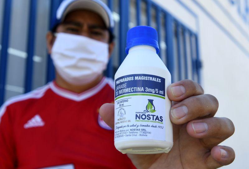 FILE PHOTO: Manuel Negrete holds the anti-parasite drug ivermectin after buying it with a medical prescription at a local pharmacy in Santa Cruz, Bolivia May 19, 2020. REUTERS/Rodrigo Urzagasti/File Photo
