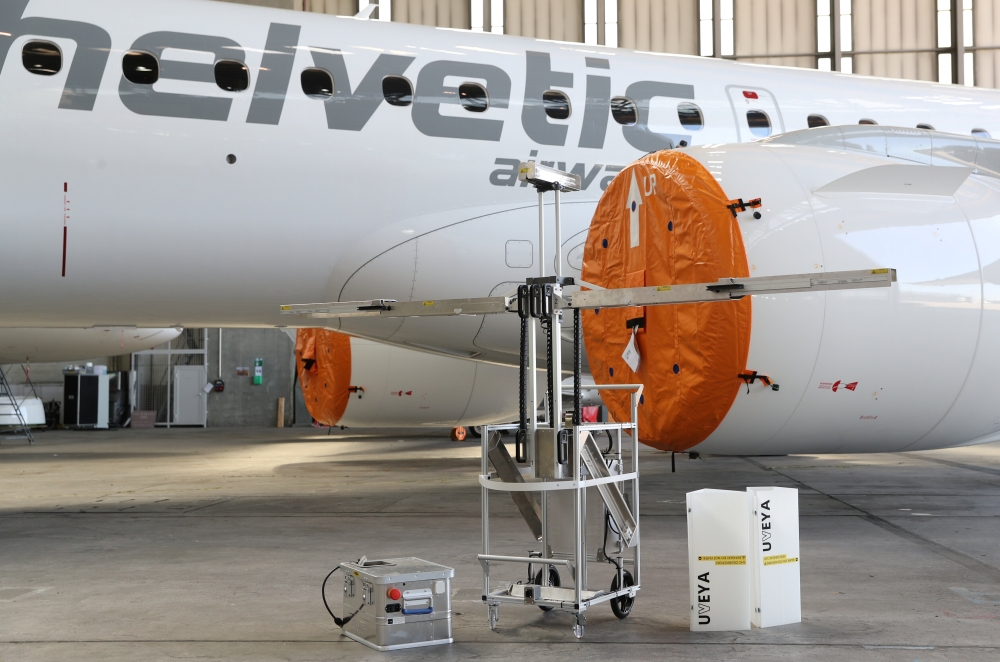 A robot developed by Swiss company UVeya armed with virus-killing ultraviolet light is seen in front of an Embraer airplane of Helvetic Airways, as the spread of the coronavirus disease (COVID-19) continues, at Zurich Airport in Zurich, Switzerland March 