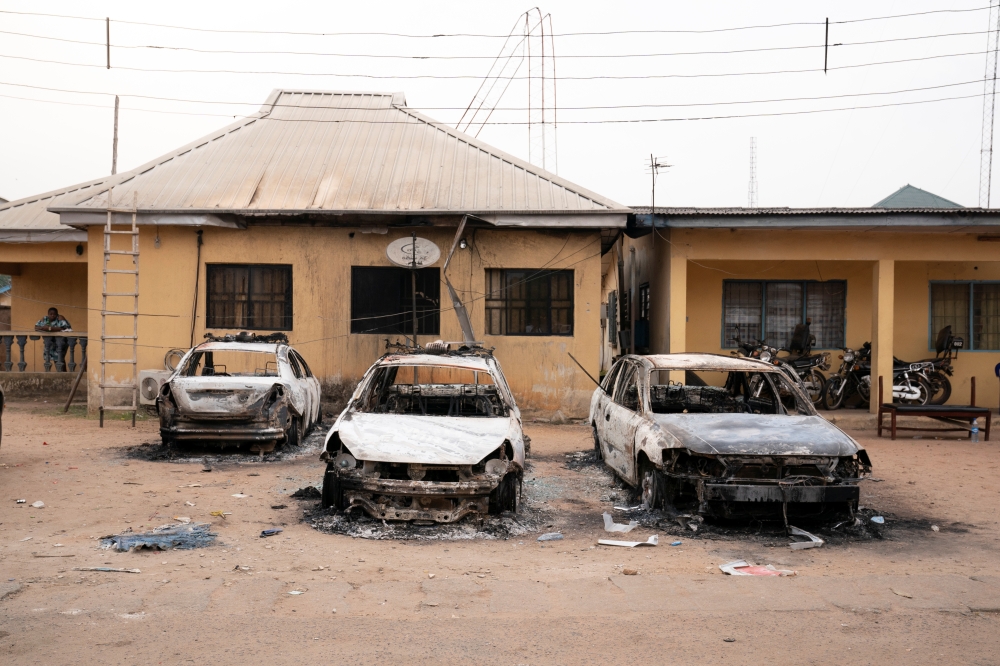 Burnt vehicles are seen outside the Nigeria police force Imo state command headquarters after gunmen attacked and set properties ablaze in Imo State, Nigeria April 5, 2021. Picture taken April 5, 2021. David Dosunmu/Handout via Reuters