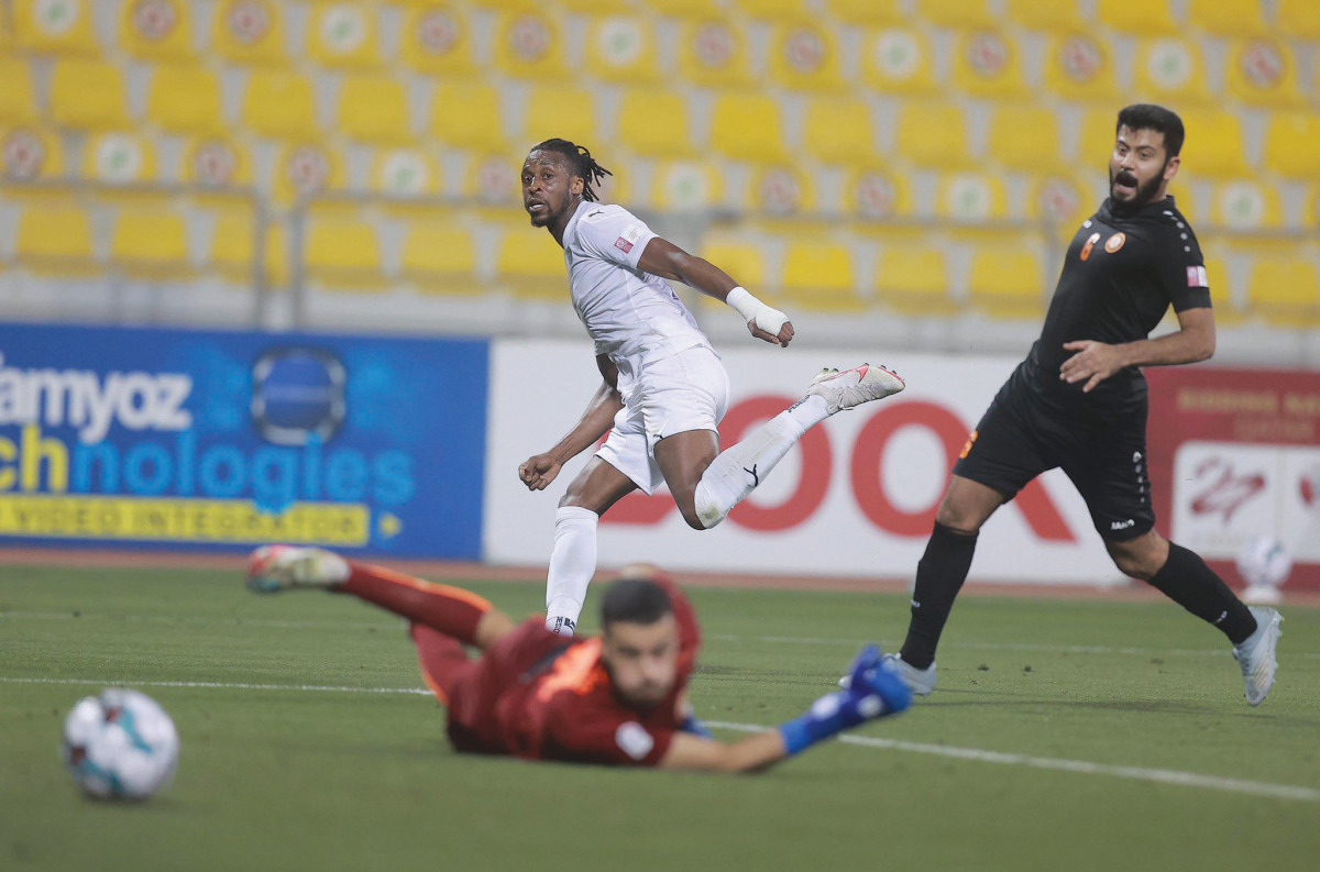 Jonathan Kodjia (centre) scores Al Gharafa's fourth goal against Umm Salal at Qatar SC Stadium yesterday. 