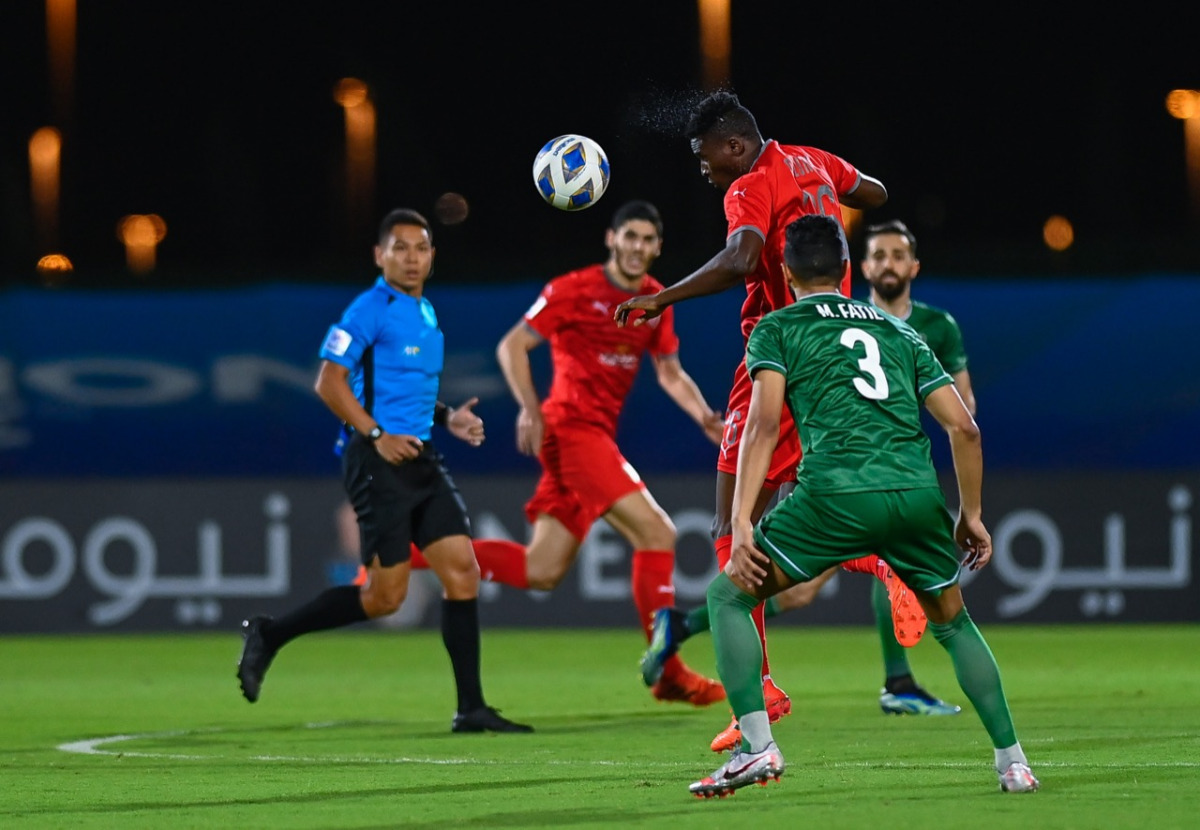 Al Duhail's Michael Olunga heads the ball during his team's second Group C match against Al Ahli Saudi FC in Jeddah, yesterday.