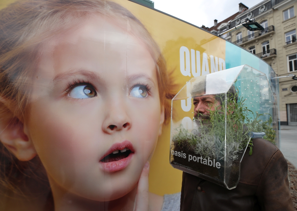 Belgian artist Alain Verschueren wears his 