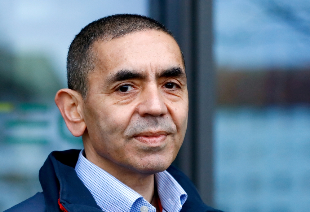 File photo: CEO and co-founder of BioNTech, Ugur Sahin, answers journalists' questions after the European Medicines Agency (EMA) approved its COVID-19 vaccine, at the company headquarters in Mainz, Germany December 22, 2020. REUTERS/Ralph Orlowski/File Ph