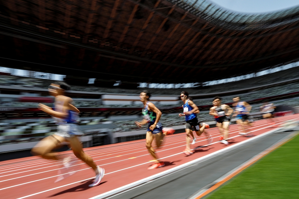 Japan's Kazuto IIzawa (11) competes with others during the men's 1500mm final at the morning session of the Athletics test event. REUTERS/Issei Kato