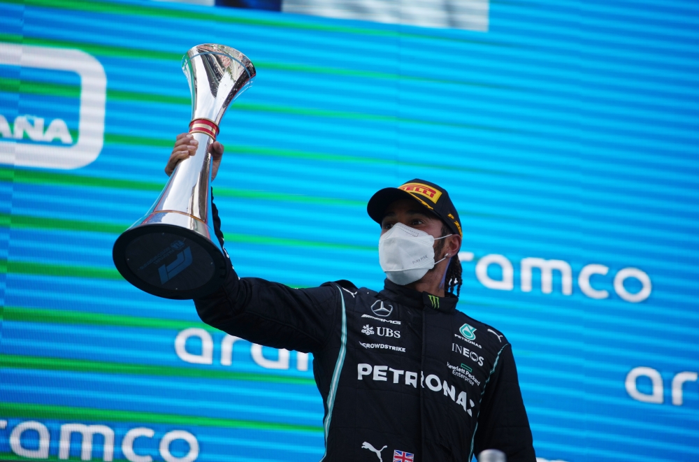May 9, 2021 Mercedes' Lewis Hamilton celebrates on the podium with a trophy after winning the race Pool via REUTERS/Emilio Morenatti