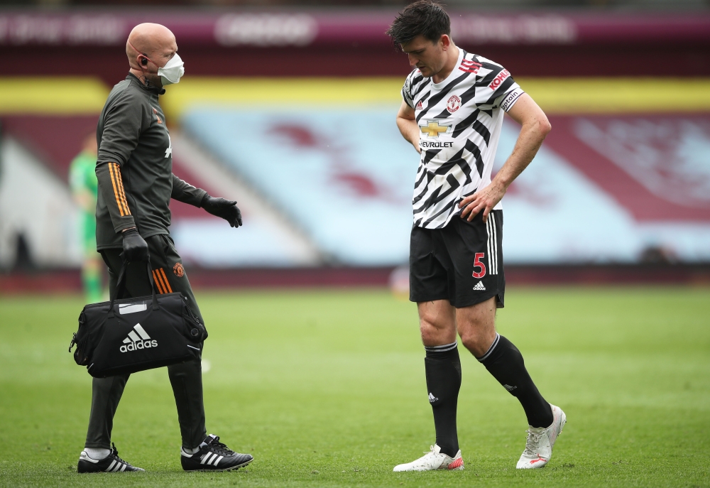 May 9, 2021 Manchester United's Harry Maguire leaves the pitch after sustaining an injury Pool via REUTERS/Nick Potts