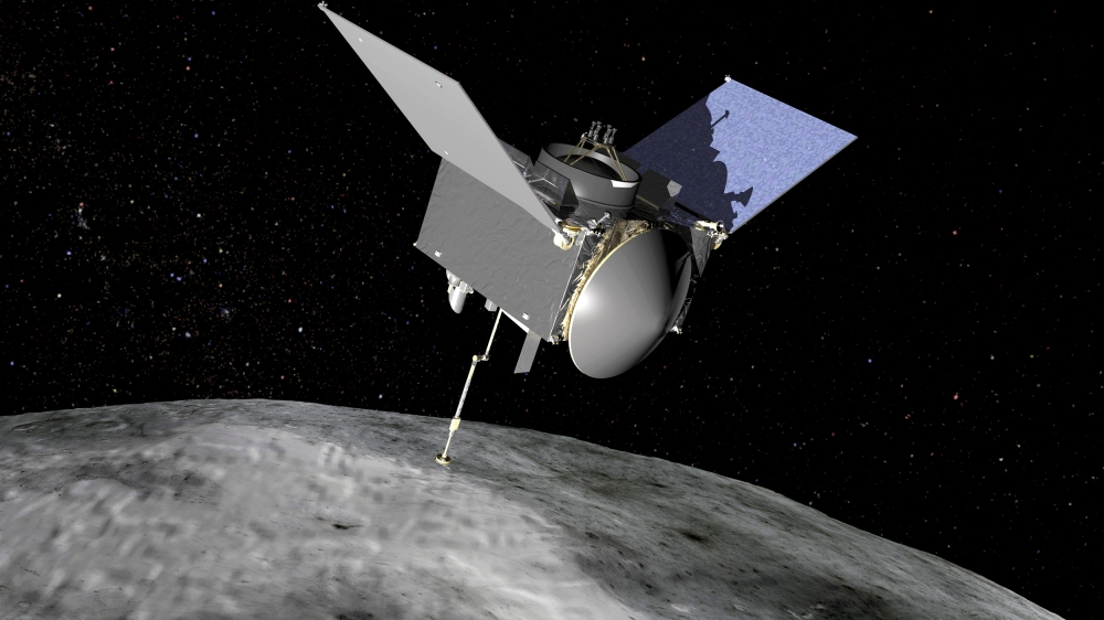 File photo: The Origins, Spectral Interpretation, Resource Identification, Security-Regolith Explorer (OSIRIS-REx) spacecraft which will travel to the near-Earth asteroid Bennu and bring a sample back to Earth for study is seen in an undated NASA artist r