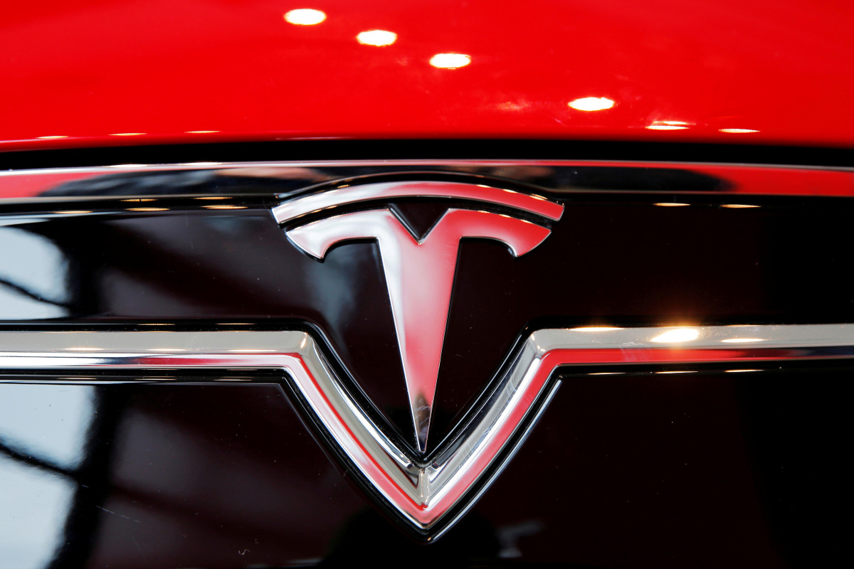 FILE PHOTO: A Tesla logo on a Model S is photographed inside of a Tesla dealership in New York, U.S., April 29, 2016. REUTERS/Lucas Jackson//File Photo
