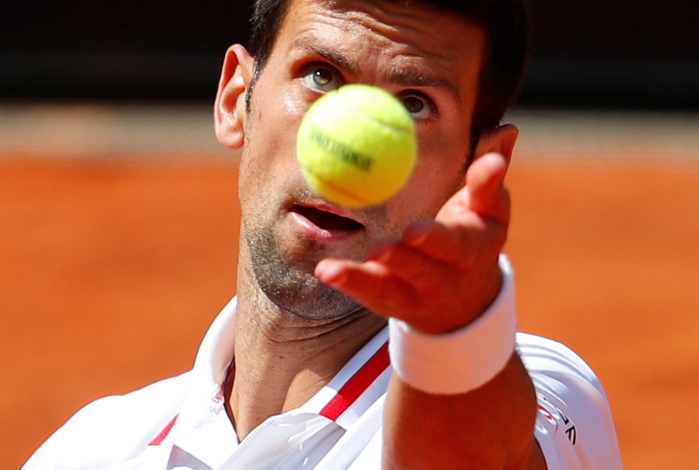 Serbia's Novak Djokovic in action during his quarter final match against Greece's Stefanos Tsitsipas REUTERS/Guglielmo Mangiapane