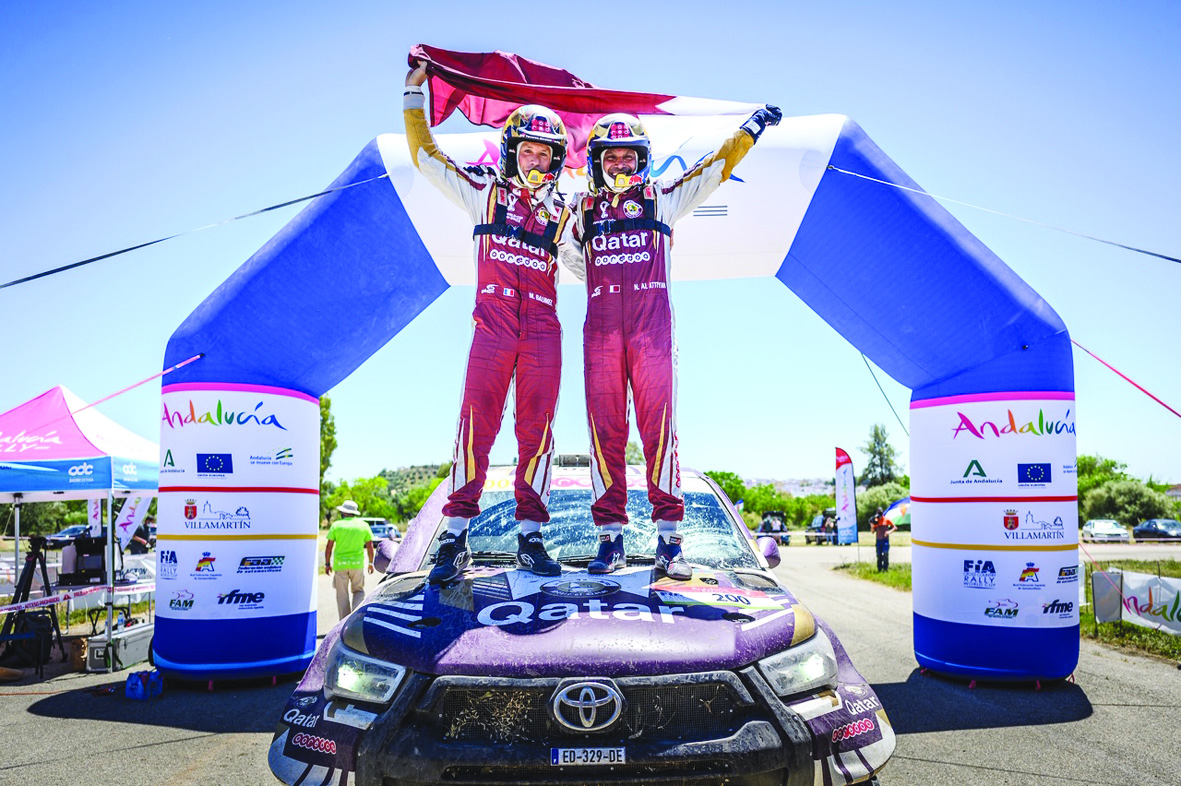 Nasser Al Attiyah and Matthieu Baumel celebrate after winning the Andalucia Rally yesterday.