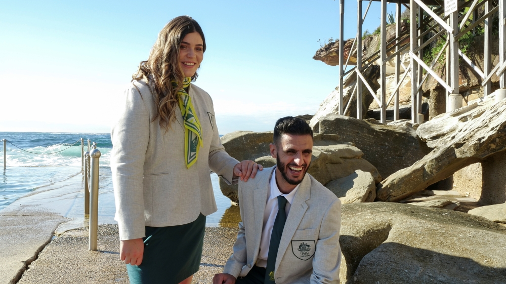 Tarni Stepto (L), a softball player, and Safwan Khalil, a taekwondo athlete, pose during the unveiling of the Australian Olympic Team Opening Ceremony uniform in Sydney, Australia, May 18, 2021. REUTERS/Jill Gralow