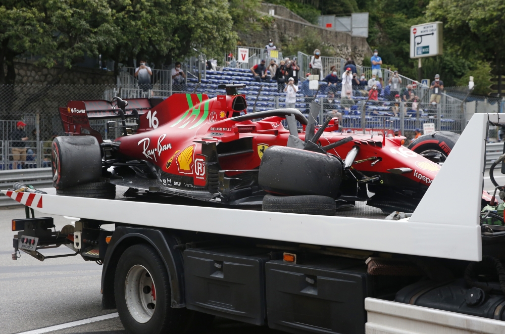 The car of Ferrari's Charles Leclerc is recovered after he crashed in qualifying Pool via REUTERS/Sebastien Nogier