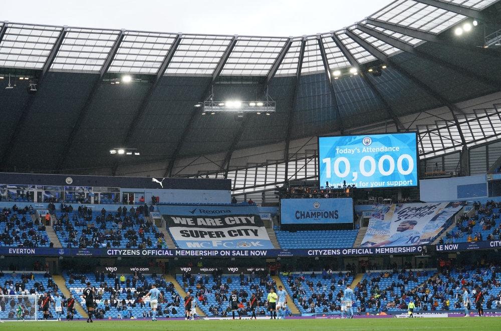 Soccer Football - Premier League - Manchester City v Everton - Etihad Stadium, Manchester, Britain - May 23, 2021 General view as the big screen displays the attendance, as a limited number of fans are permitted at outdoor sports venues Pool via REUTERS/D