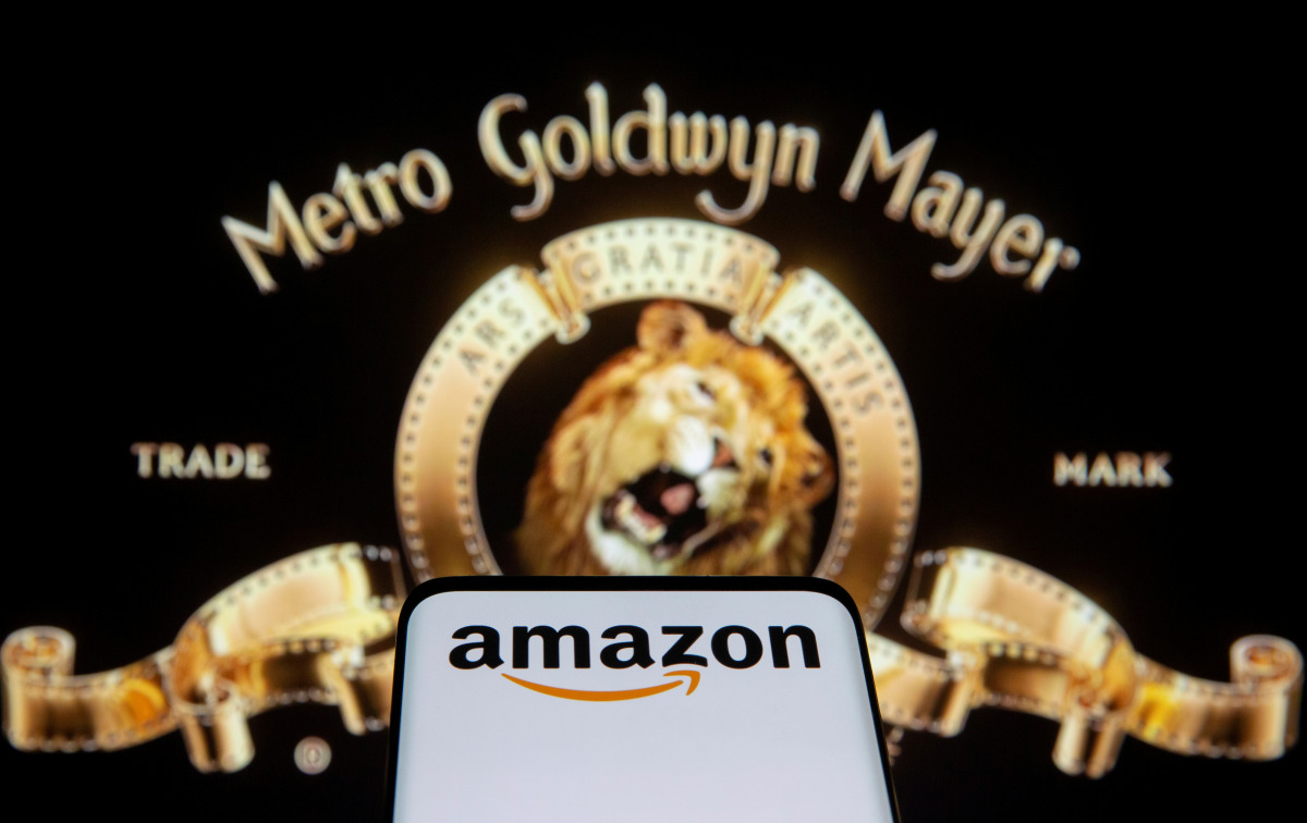 FILE PHOTO: Smartphone with Amazon logo is seen in front of displayed MGM logo in this illustration taken, May 26, 2021. REUTERS/Dado Ruvic/Illustration/File Photo
