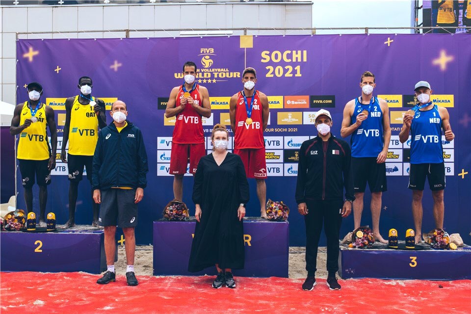 Qatar’s Cherif Younousse and Ahmed Tijan (left) pose with their silver medals on the podium, along with other medal winners and officials in Sochi, yesterday.  